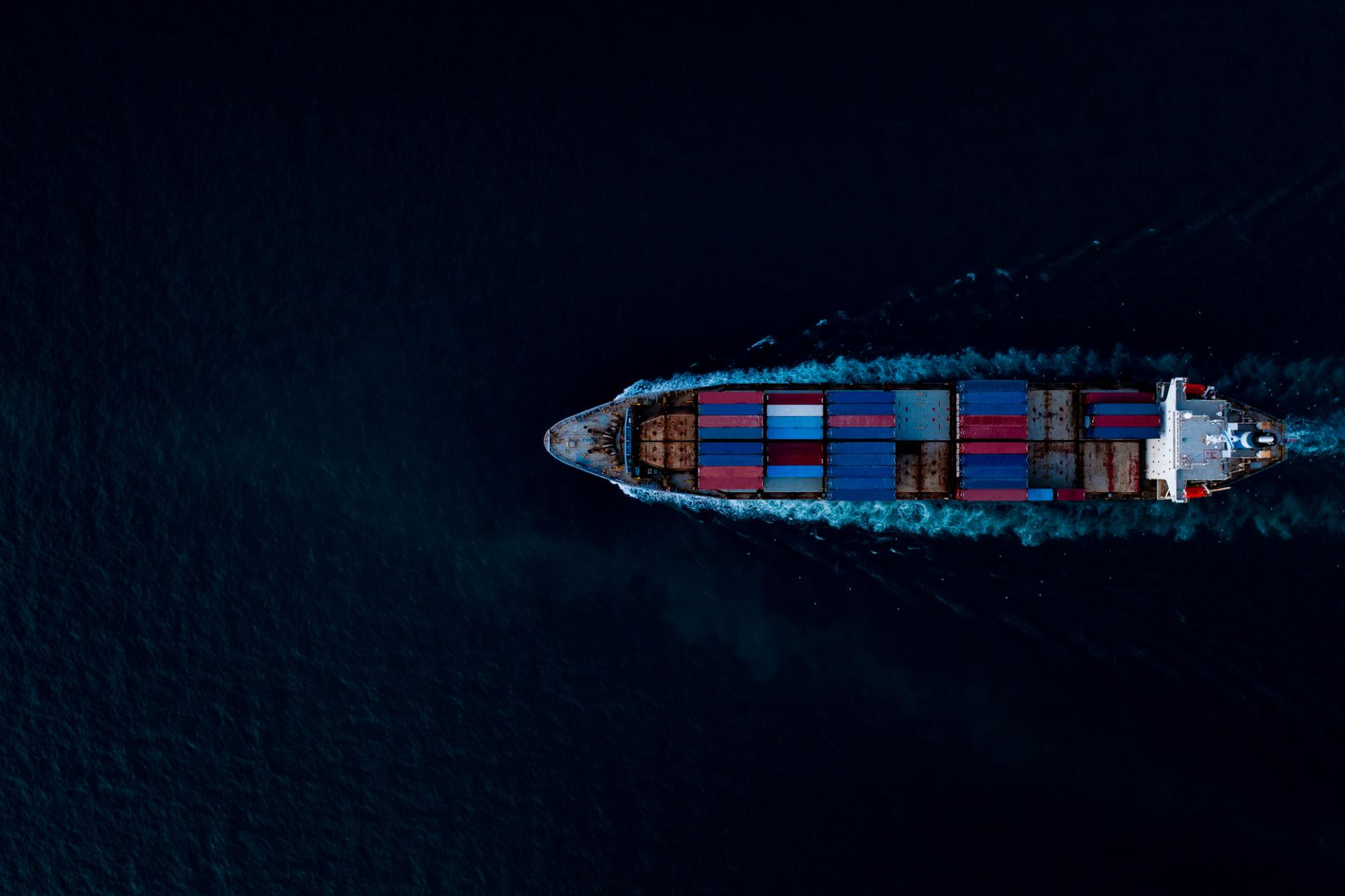 Aerial view of a container ship navigating open water